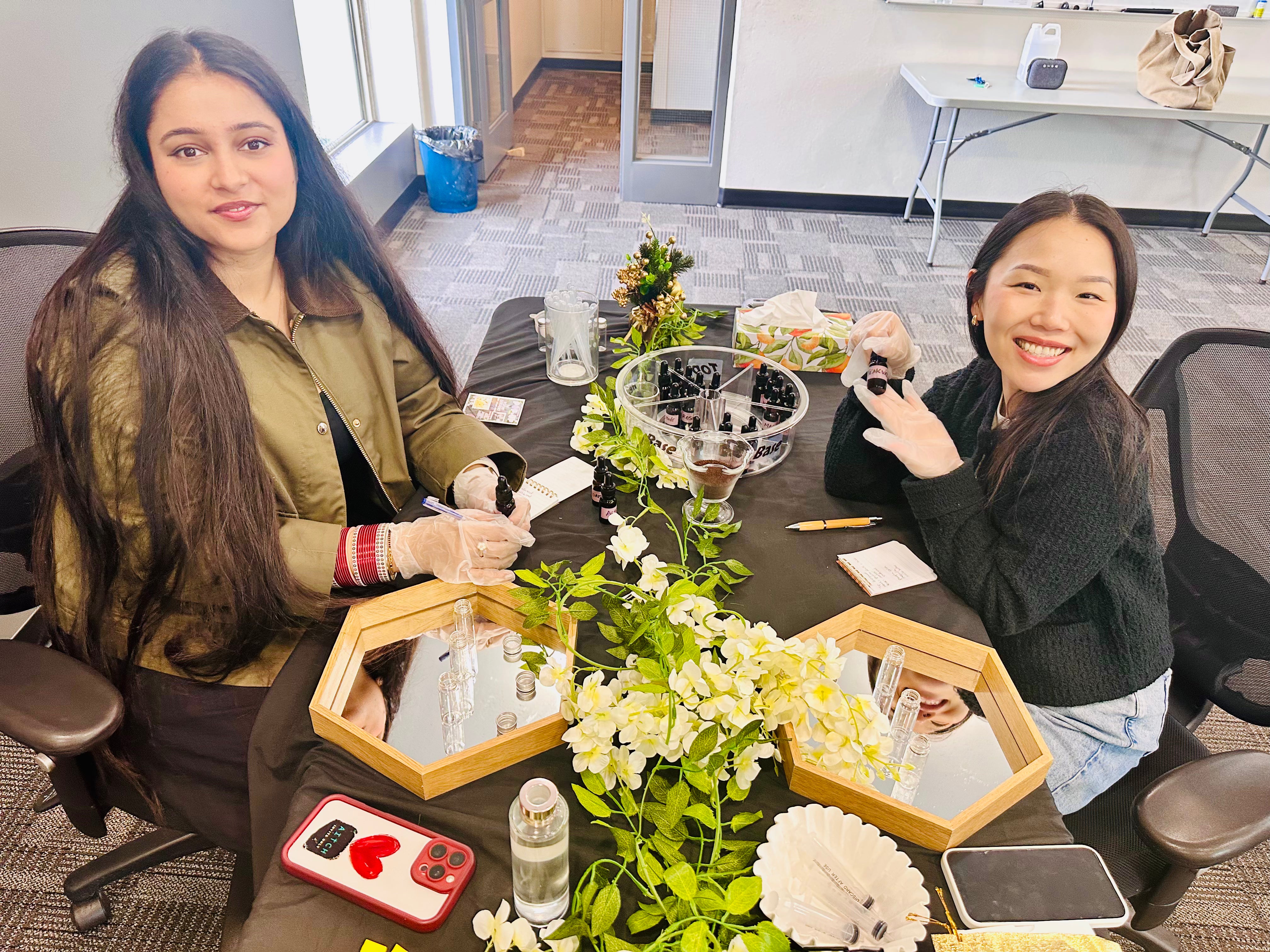 Perfume workshops in Vancouver: two friends at a private session for two, making natural perfume from the ARTEI PHIRE palette