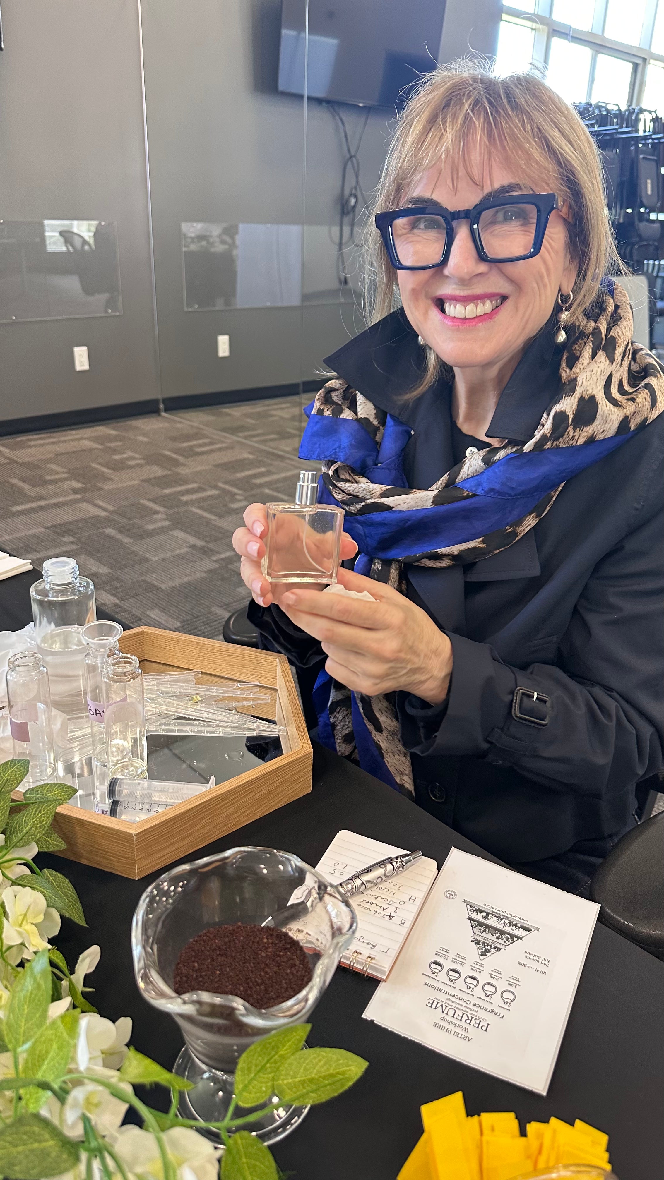 Make your own perfume in Vancouver: a guest holding the custom perfume she blended at an ARTEI PHIRE perfume class