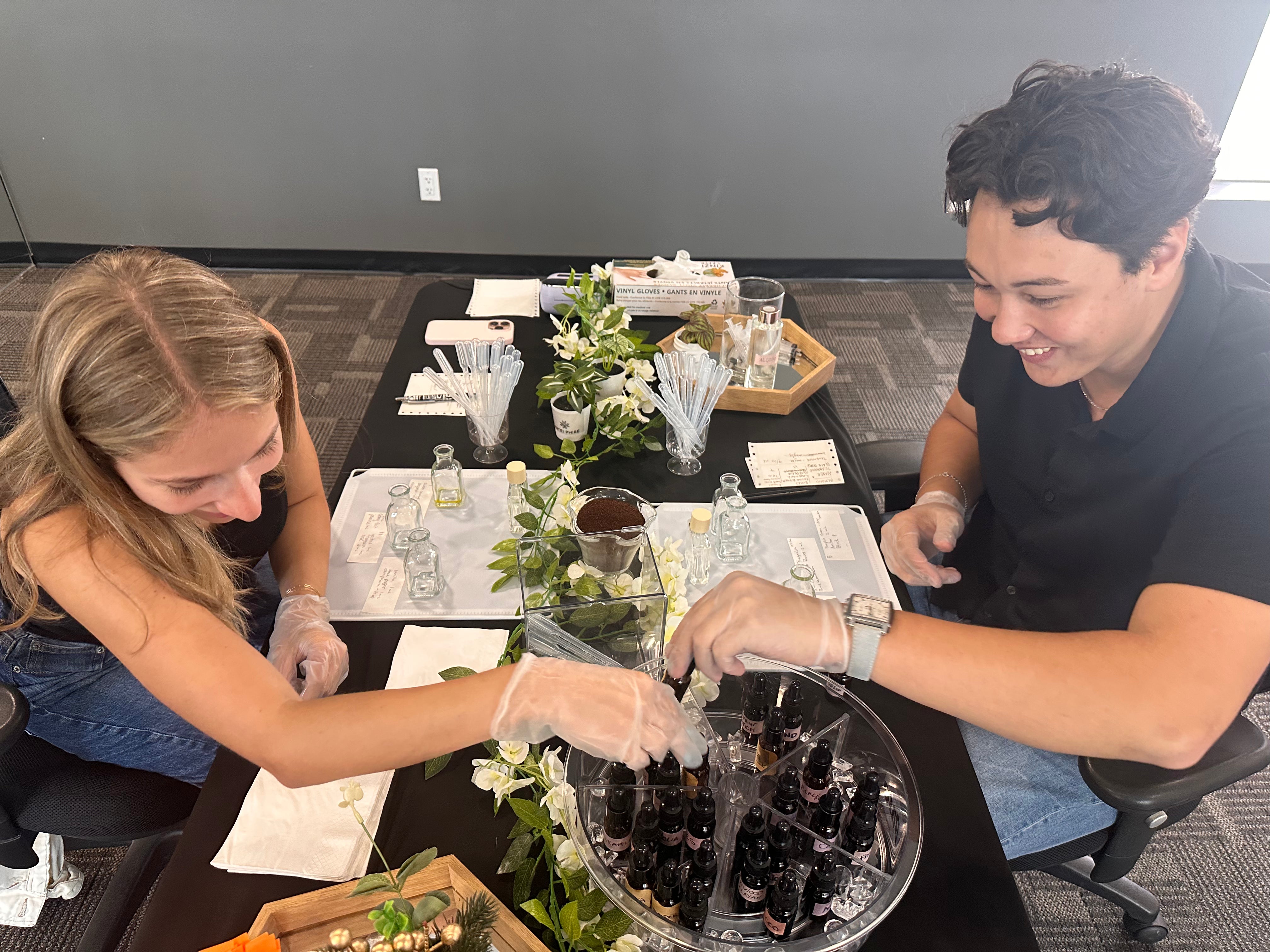 Date ideas in Vancouver: a couple on a date night making their own perfume at a private perfume workshop for two